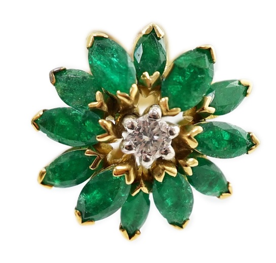 A modern pair of gold, emerald and diamond set flowerhead stud earrings